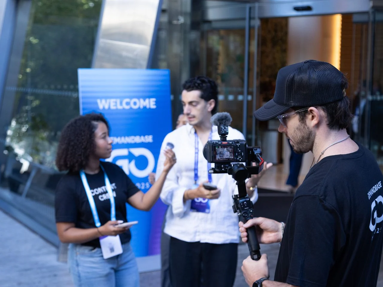 An EventShark camera operator interviewing an attendee at the Demandbase GO event